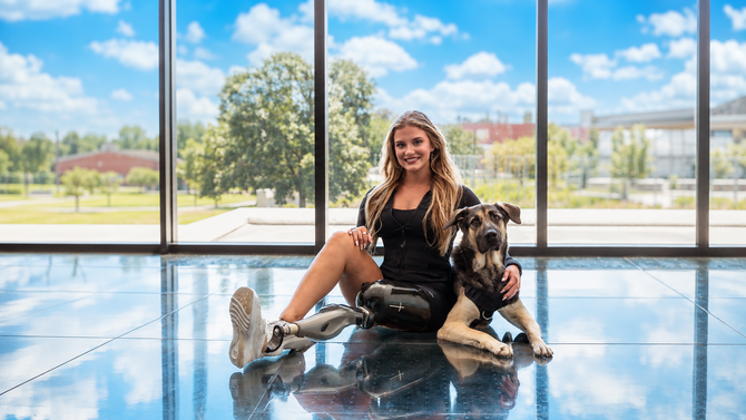 Tatum with her dog and the Ethnocare Overlay