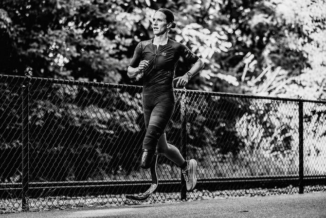 Hannah Nabors smiling outdoors while wearing her below-knee prosthesis